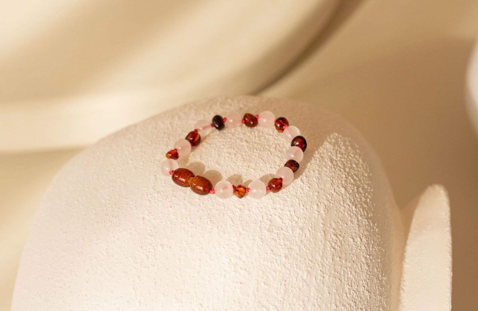 Barnsteen armband roze baby